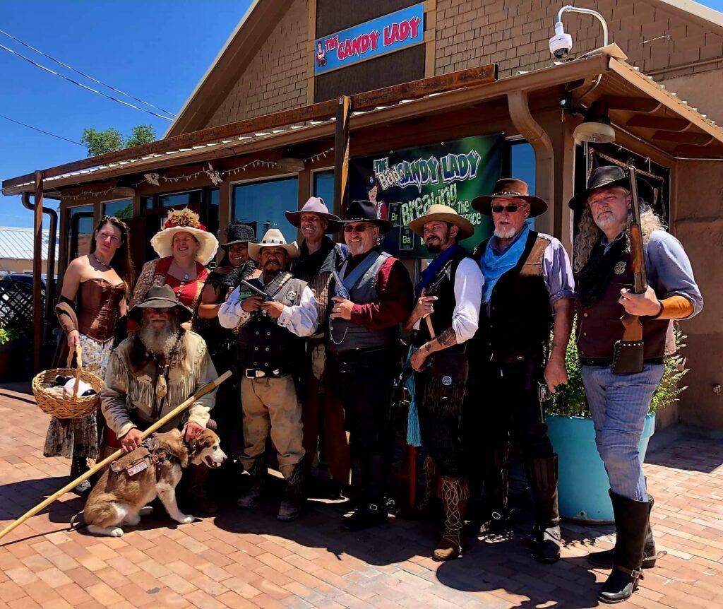 New Mexico Gunfighters in front of one of our sponsors, The Candy Lady